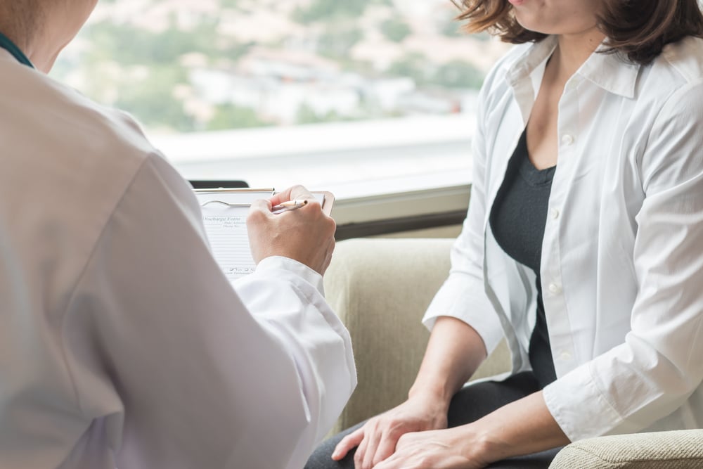 Woman talking to doctor about low libido, vaginal dryness, and hormones in Melville, NY